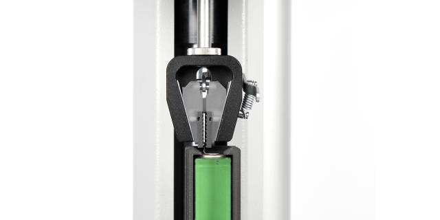 Custom designed lower fixture secures the battery body against the tensile lo